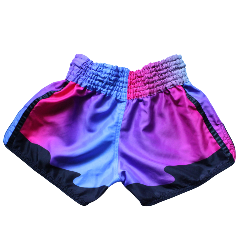 Colorful shorts with a pink and blue gradient design on a white background